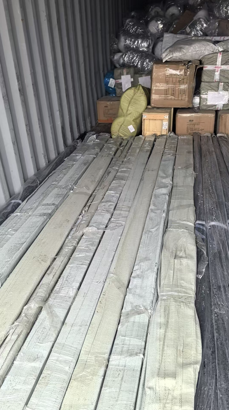Galvanized support channels and duct components bundled in the container