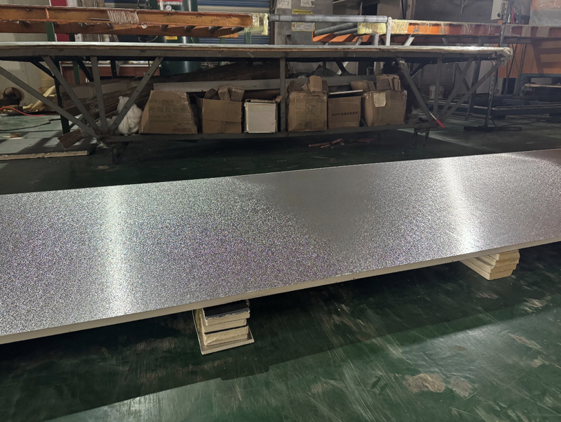 Foil-faced aluminium insulation sheet resting on wooden blocks