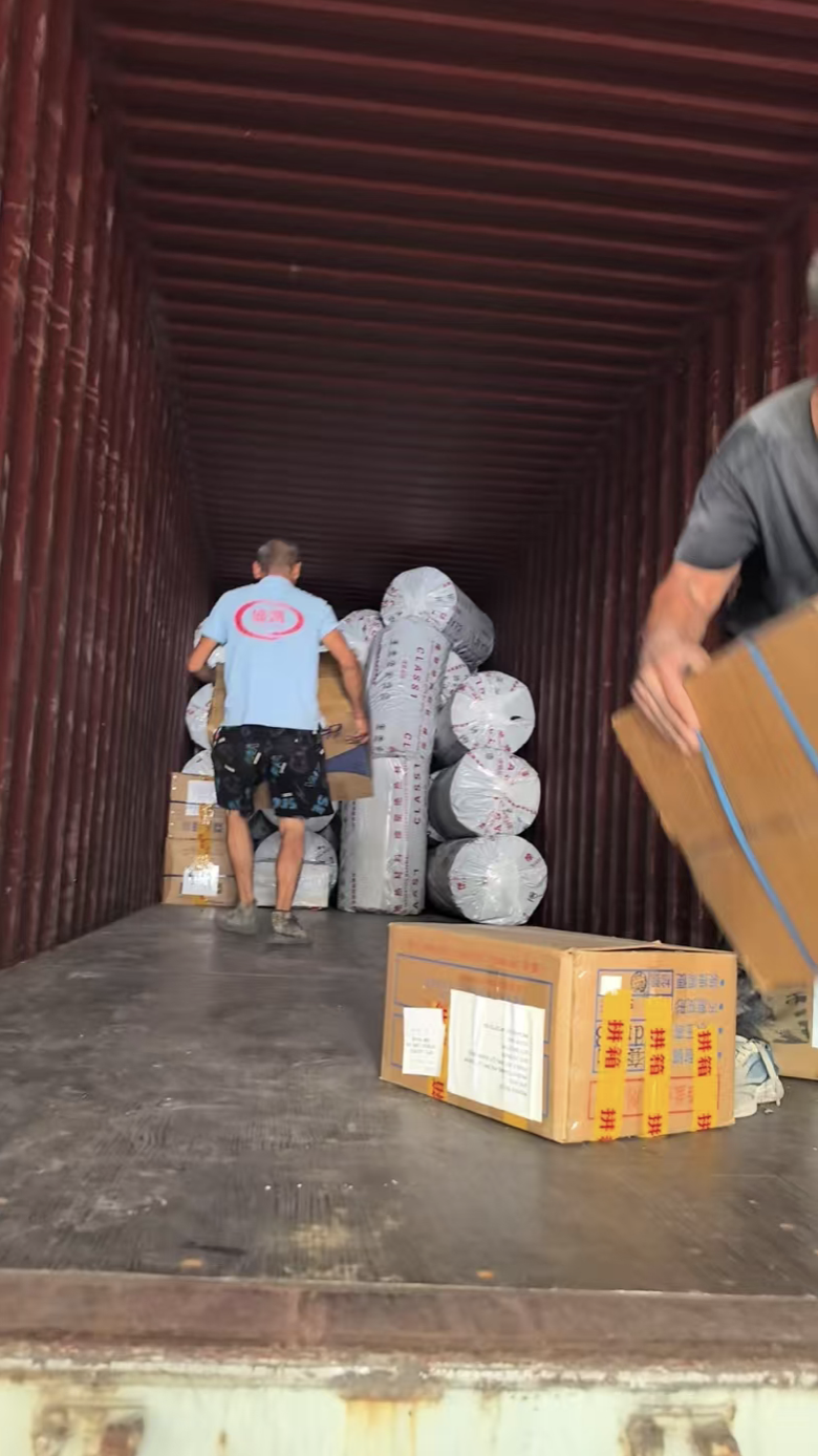 Rubber insulation rolls and cartons loaded inside the shipping container